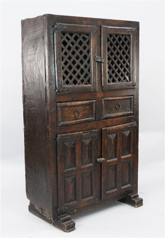 An antique Spanish walnut food cupboard, W.2ft 10in. D.1ft 7in. H.4ft 10in.
